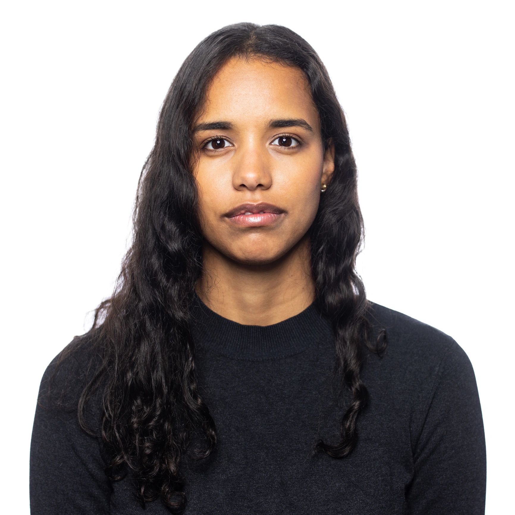 Portrait headshot of a woman on a light background