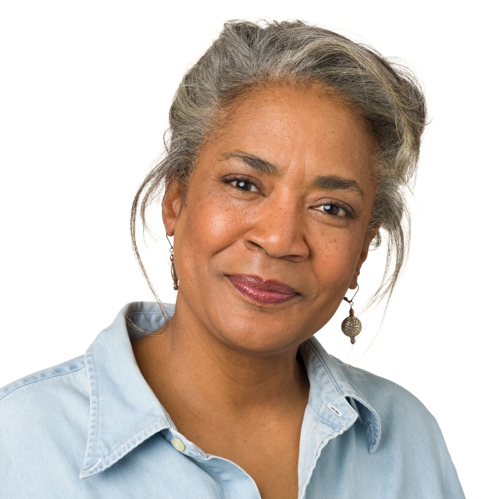 Portrait headshot of a mature woman on a white background